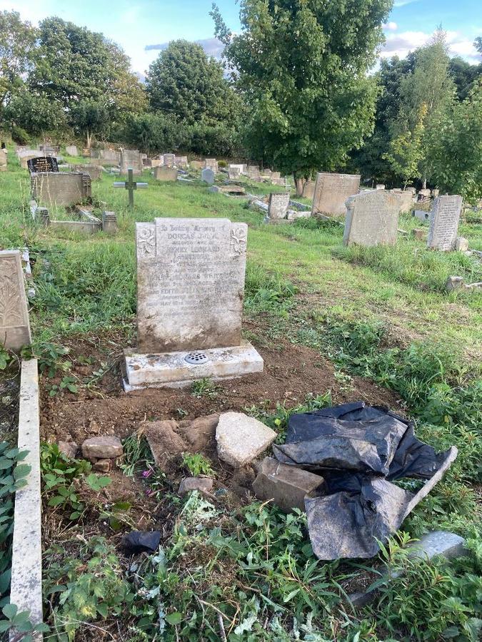 Another fallen headstone now upright